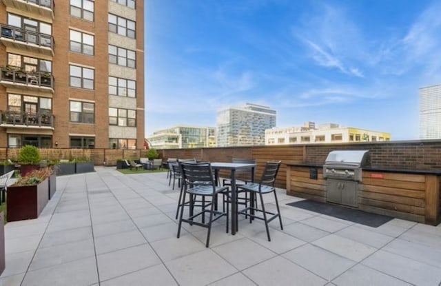 view of patio with area for grilling and grilling area