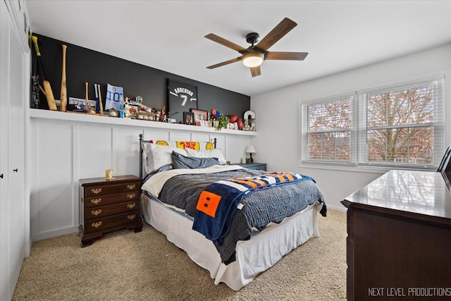 bedroom with ceiling fan and carpet floors