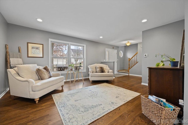 living room featuring dark wood-type flooring