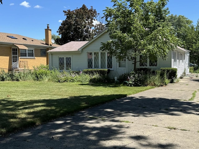 exterior space featuring a front lawn