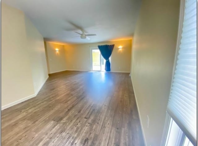 unfurnished room featuring ceiling fan and hardwood / wood-style floors