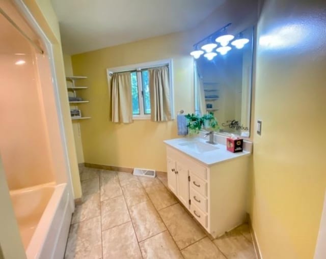 bathroom featuring tile patterned floors and vanity