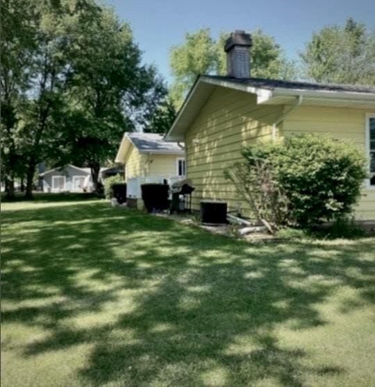 view of property exterior featuring a yard