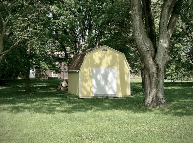 view of outbuilding featuring a yard