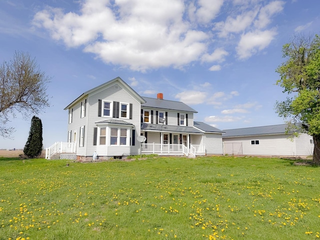 174 Rockyford Rd, Sublette, IL 61367 - view of front of property with a porch, a front lawn, and a chimney