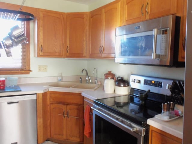 kitchen featuring stainless steel appliances and sink