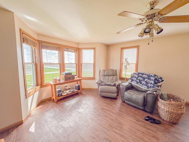 174 Rockyford Rd, Sublette, IL 61367 - sitting room with wood finished floors, baseboards, and ceiling fan