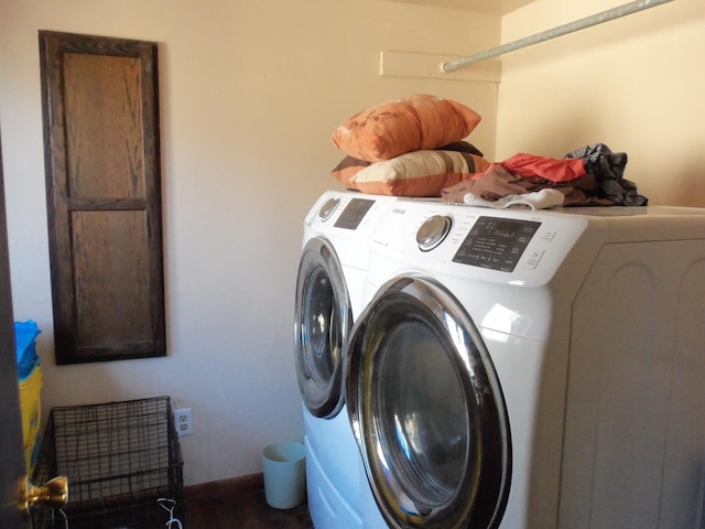 washroom with cabinets and independent washer and dryer