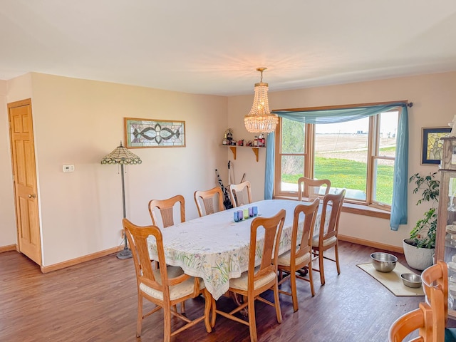 174 Rockyford Rd, Sublette, IL 61367 - dining space with baseboards, light wood finished floors, and a chandelier