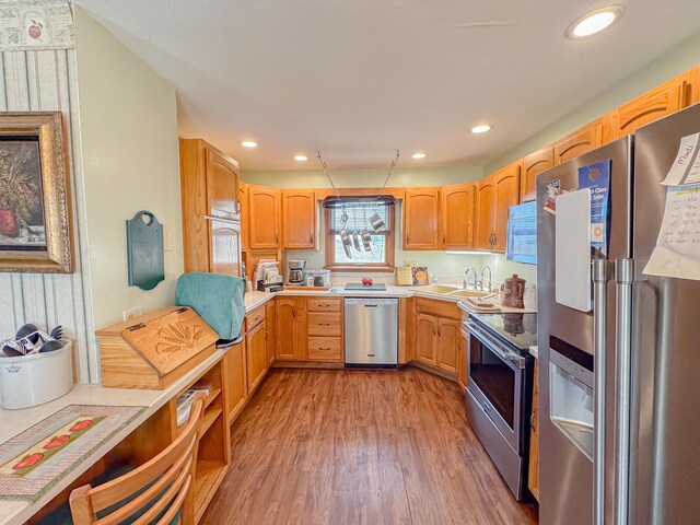 174 Rockyford Rd, Sublette, IL 61367 - kitchen featuring stainless steel appliances, a sink, wood finished floors, light countertops, and recessed lighting