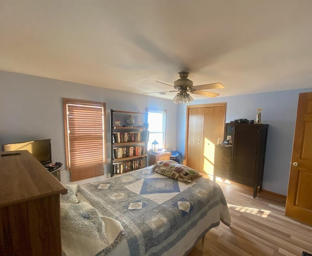 bedroom featuring ceiling fan and light hardwood / wood-style floors