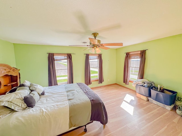 174 Rockyford Rd, Sublette, IL 61367 - bedroom featuring light wood finished floors, a ceiling fan, and baseboards