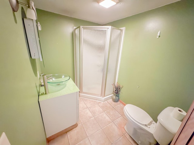 174 Rockyford Rd, Sublette, IL 61367 - bathroom featuring toilet, a stall shower, vanity, and tile patterned flooring