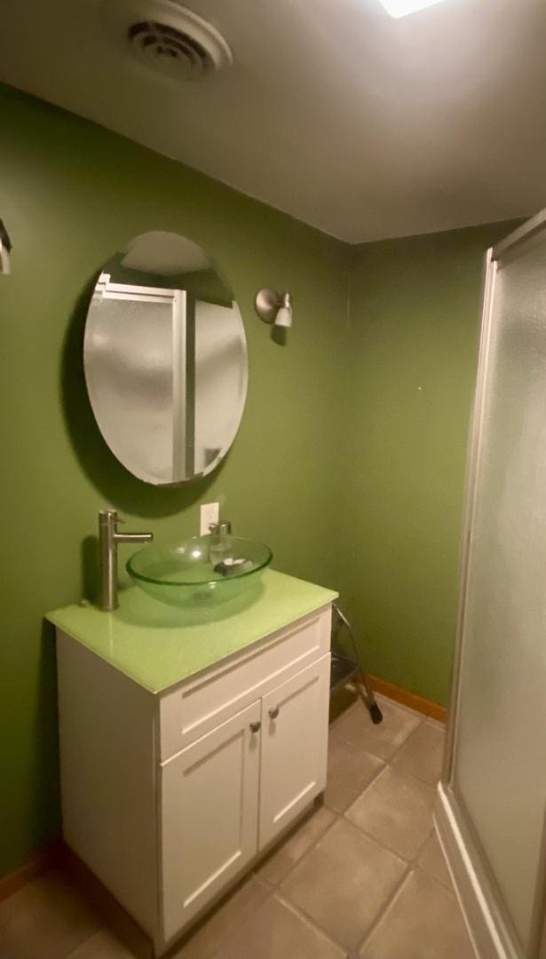 bathroom with vanity and tile patterned flooring