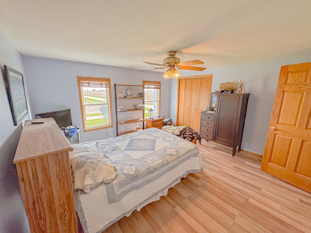 174 Rockyford Rd, Sublette, IL 61367 - bedroom featuring light wood-type flooring, ceiling fan, a closet, and baseboards