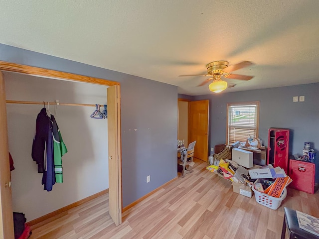 174 Rockyford Rd, Sublette, IL 61367 - bedroom featuring light wood-style flooring, a ceiling fan, baseboards, and a textured ceiling