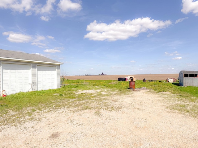 174 Rockyford Rd, Sublette, IL 61367 - view of yard with an outdoor structure and a detached garage