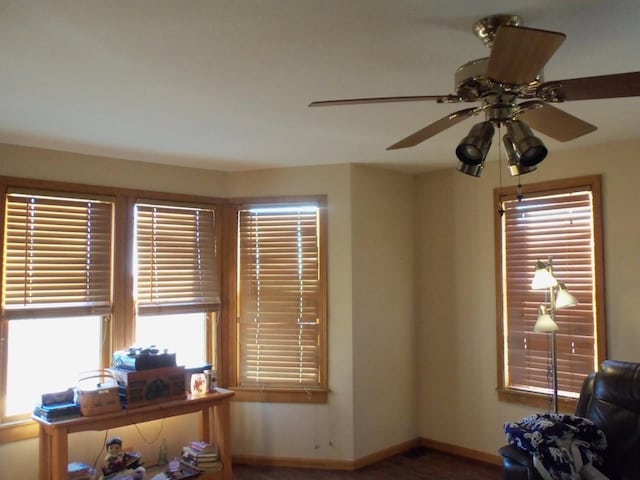 living area with ceiling fan