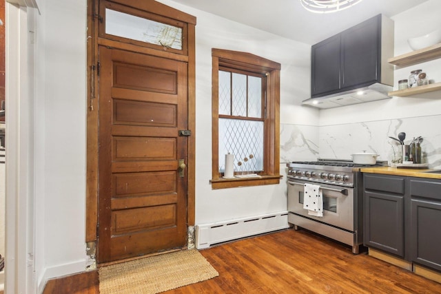 kitchen with baseboard heating, dark hardwood / wood-style flooring, double oven range, gray cabinets, and decorative backsplash