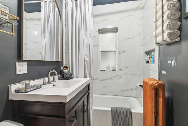 bathroom featuring vanity, radiator, and shower / bath combo with shower curtain