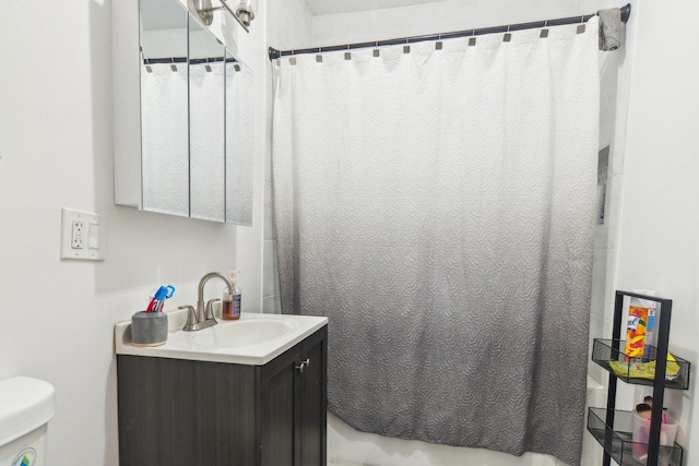 bathroom featuring vanity and toilet