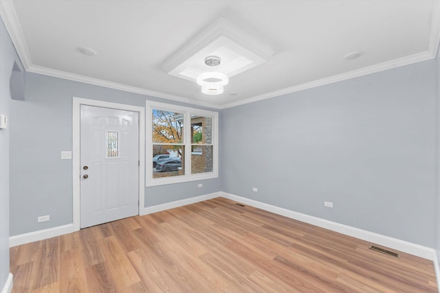 entrance foyer with light wood-type flooring and ornamental molding