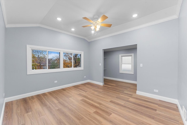 unfurnished bedroom with ceiling fan, lofted ceiling, crown molding, and light hardwood / wood-style flooring