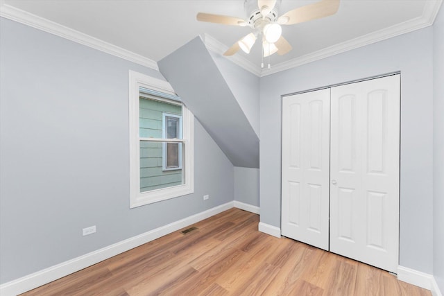 bonus room with ceiling fan, light hardwood / wood-style floors, and vaulted ceiling