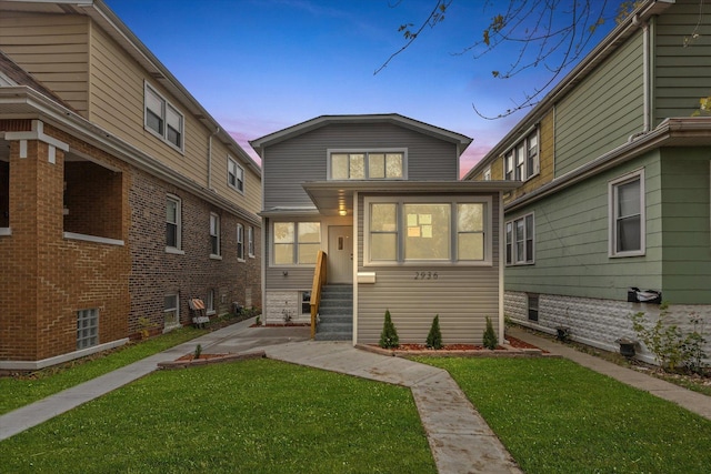 view of front of house with a yard