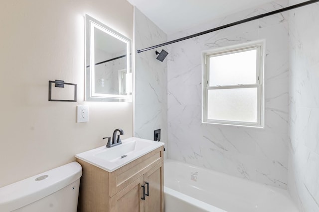 full bathroom featuring vanity, toilet, and tiled shower / bath