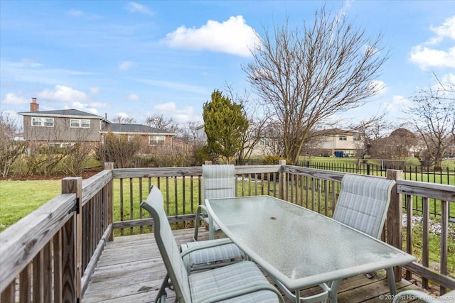 wooden terrace with a yard