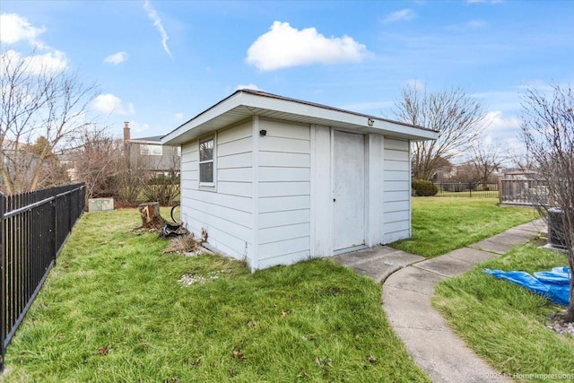 view of outdoor structure with a lawn