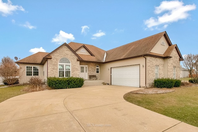 view of front of home featuring a garage and a front lawn