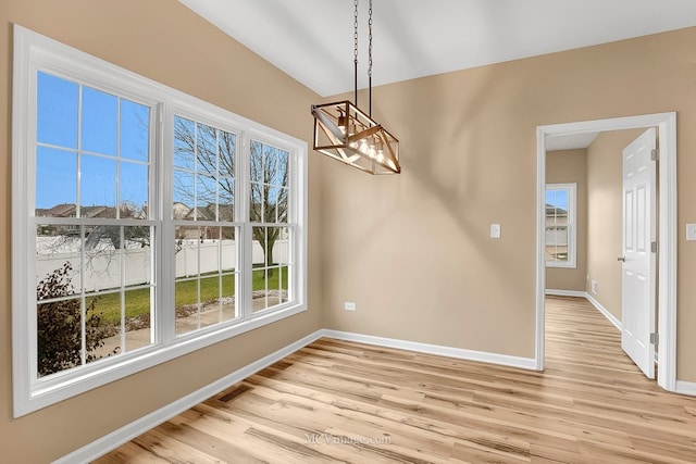 unfurnished dining area with light wood-type flooring and a wealth of natural light