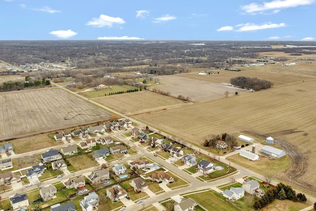 birds eye view of property with a rural view