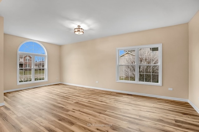 spare room with light wood-type flooring