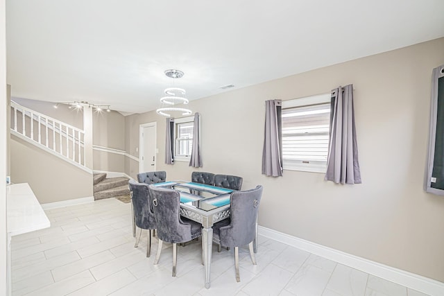 dining area with light tile patterned floors