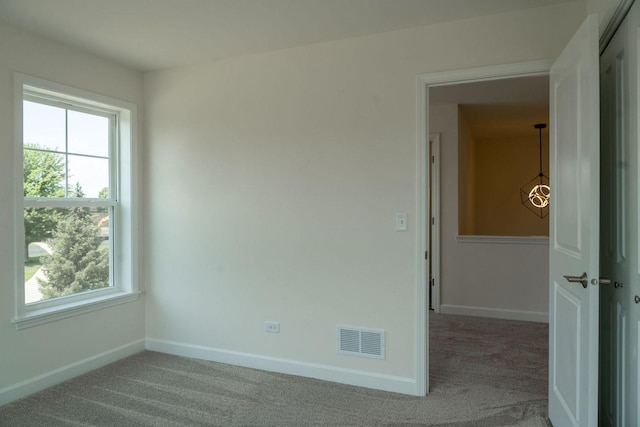 view of carpeted spare room