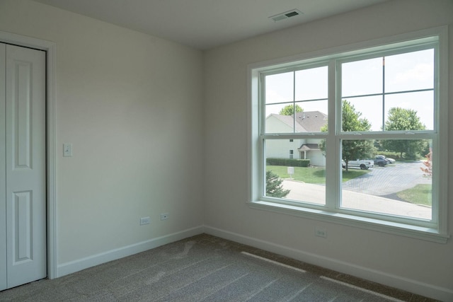 empty room featuring carpet flooring