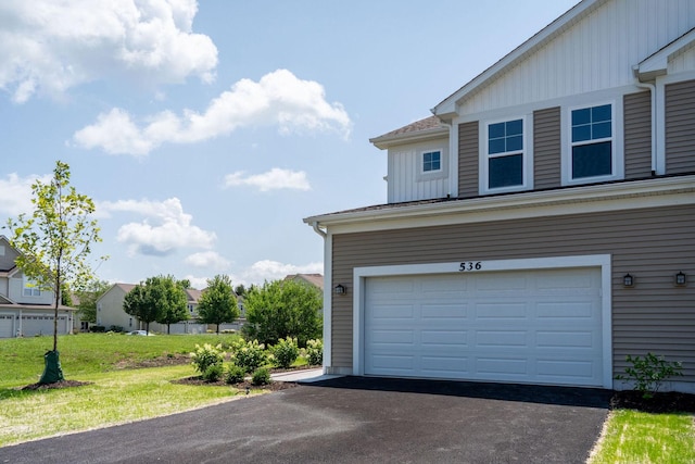 garage featuring a yard