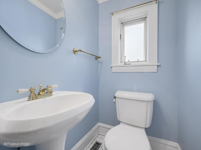 bathroom featuring tile patterned floors, sink, ornamental molding, and toilet