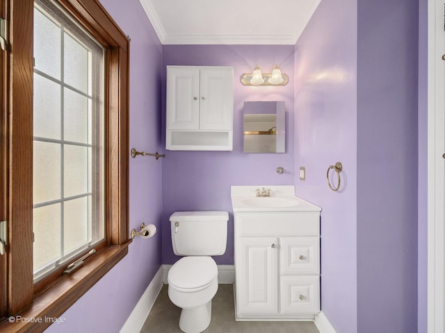 bathroom with vanity, toilet, and crown molding