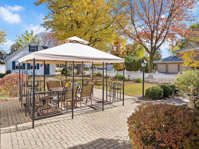 view of home's community with a gazebo and a patio area