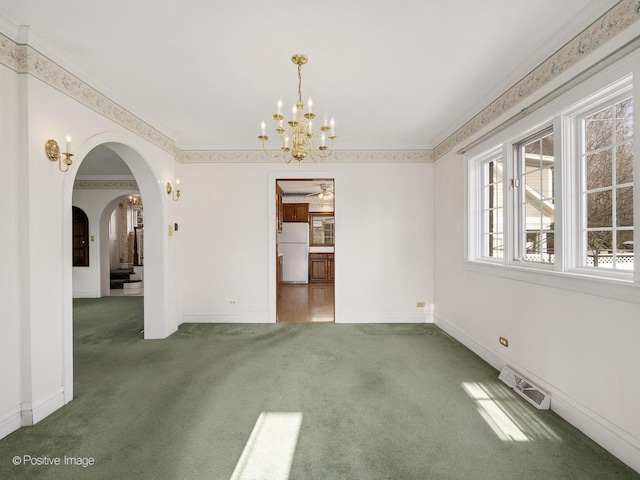 unfurnished dining area featuring dark colored carpet, a notable chandelier, and ornamental molding