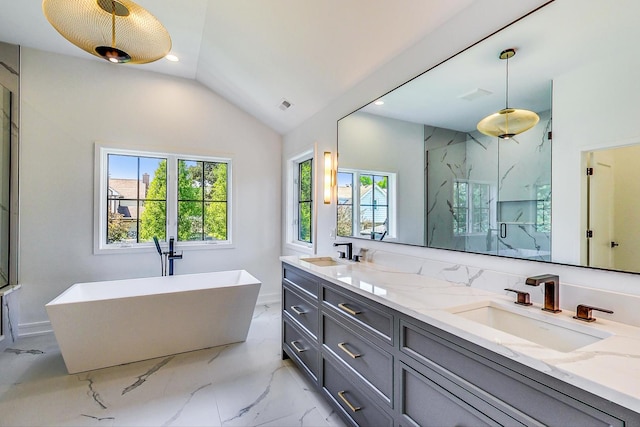 bathroom with separate shower and tub, vanity, and lofted ceiling