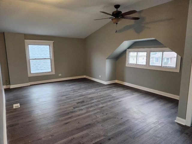 additional living space with dark hardwood / wood-style floors, ceiling fan, and lofted ceiling