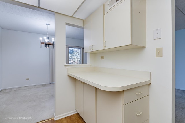 kitchen featuring a chandelier and decorative light fixtures