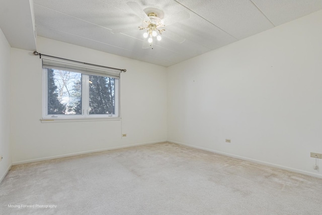 unfurnished room with light carpet and ceiling fan