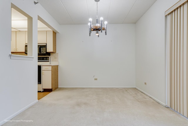 unfurnished dining area featuring light carpet and an inviting chandelier