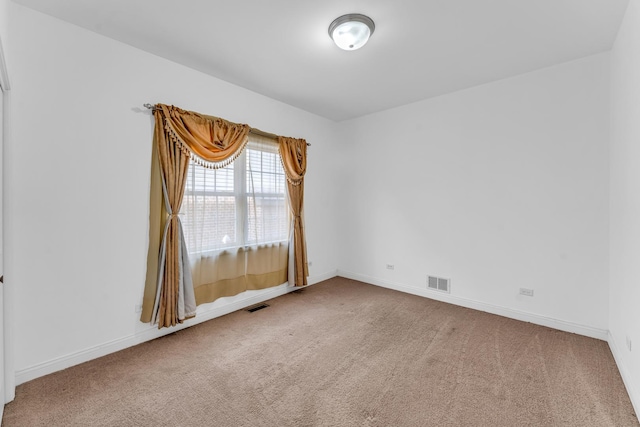 unfurnished room featuring carpet flooring